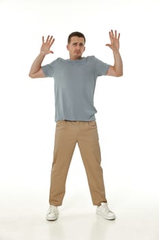 scared guy looking at camera on white studio background
