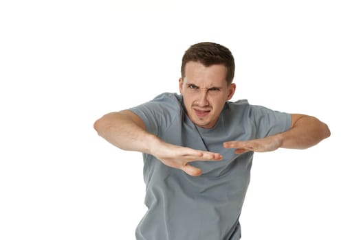 annoyed angry man fighting on white studio background