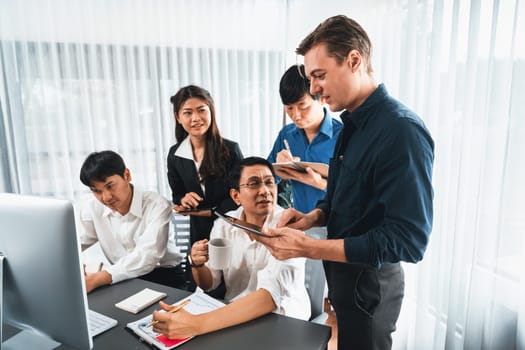 Group of diverse office worker employee working together on strategic business marketing planning in corporate office room. Positive teamwork in business workplace concept. Prudent