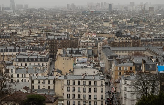 France, Paris - Jan 02, 2024 - Paris city view and rooftops of house From The Top Of Montmartre. Paris Buildings. Space for text, Selective focus.
