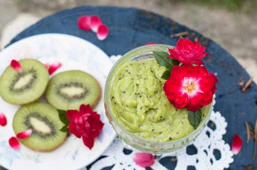 bright green mousse dessert of avocado and kiwi with chia seeds top view. High quality photo