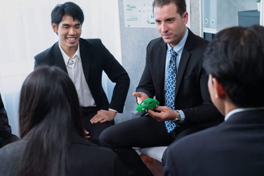 Group of business people discussing strategic marketing in electric car company meeting for eco-friendly EV car using sustainable and alternative power contribute to greener future. Quaint