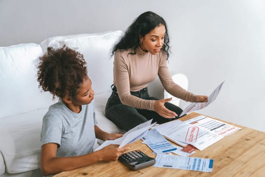 Stressed African American women has financial problems with credit card debt to pay crucial show concept of bad personal money and mortgage pay management crisis.