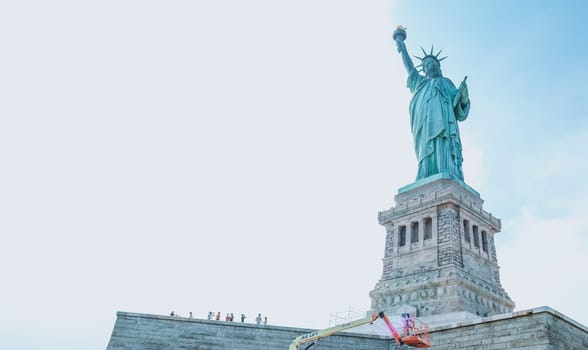 The Statue of Liberty, New York City on sunny blue sky. American symbol. Memorial day, Patriot Day. Space for text. New York NY USA 2023-07-30.