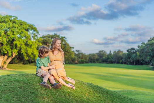 Heartwarming outdoor bonding as a pregnant mom and her son enjoy quality time together, savoring the beauty of nature and creating cherished moments.