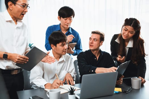 Group of diverse office worker employee working together on strategic business marketing planning in corporate office room. Positive teamwork in business workplace concept. Prudent