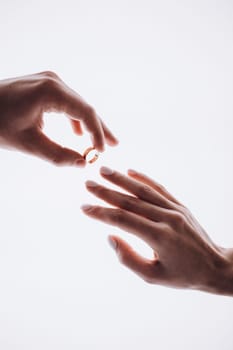 put on a wedding ring. High quality photo