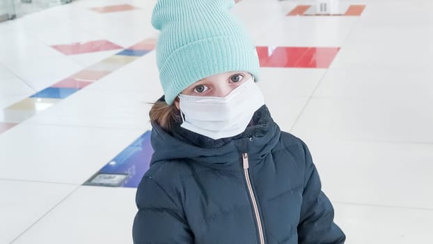 Little kid wearing ace mask for protection corona virus outbreak. New coronavirus 2019-nCoV from China.