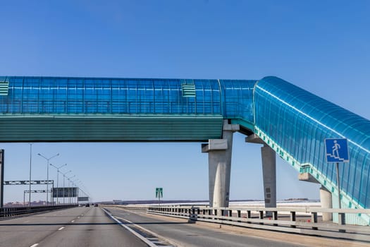 pedestrian crossing next to overpass.Convenience and safety for pedestrians.