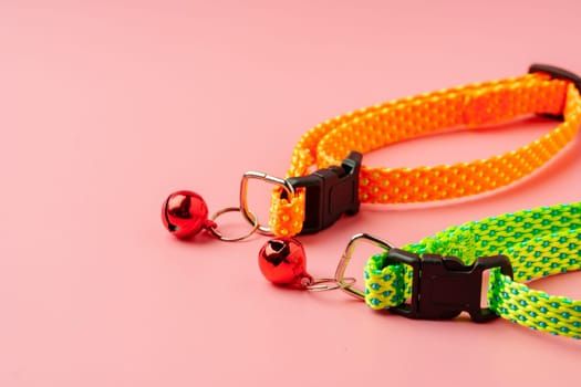 Textile pet collar on pink background studio photo close up