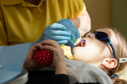 Plaque on teeth colored pink and purple.