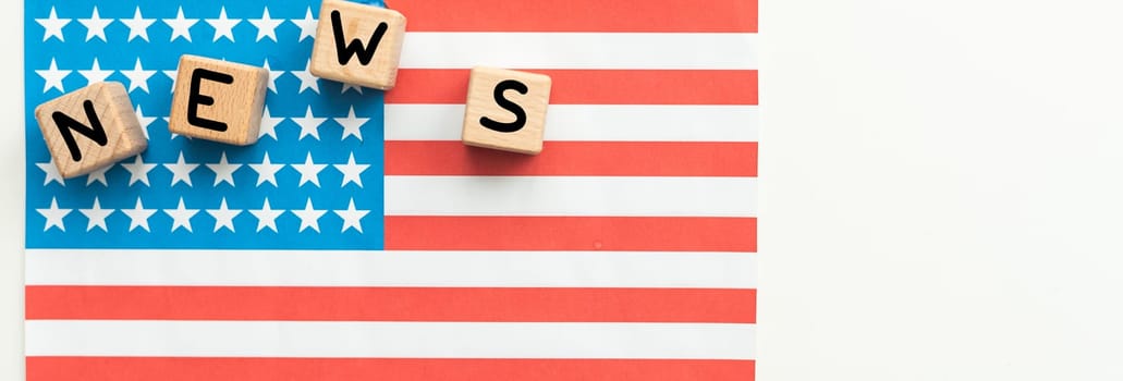 American economy and business concept. The US flag has cubes with the inscription - NEWS. High quality photo