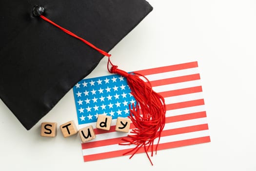 graduation hat on US flag, education concept. High quality photo