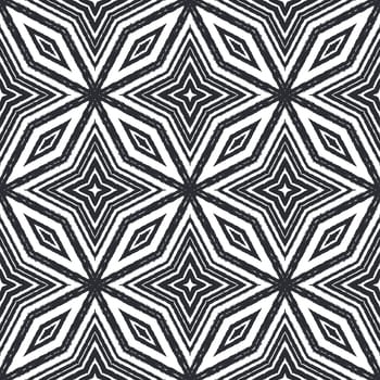 Ikat repeating swimwear design. Black symmetrical kaleidoscope background. Textile ready attractive print, swimwear fabric, wallpaper, wrapping. Summer ikat sweamwear pattern.
