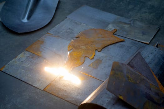 Laser cleaning of metal. The laser beam cleans the metal surface from rust. Laser removes removing old rust from metal. Innovation metalworking. New technologies