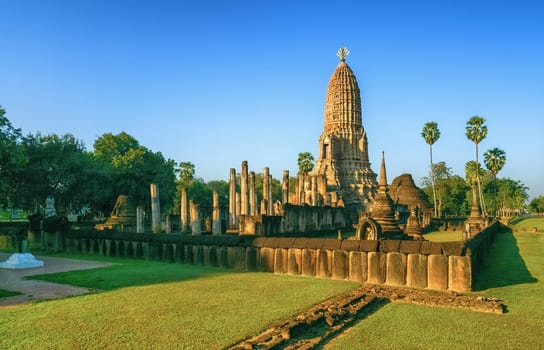 Wat Phra Sri Rattana Mahathat Rajaworavuharn temple in Si Satchanalai historical park by day, Thailand