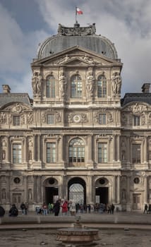 France, Paris - Jan 03, 2024 - Exterior of Palais du Louvre (Pavillon de l'Horloge) or The Louvre Palace. West facade of the sully wing, is a magnificent Renaissance palace in Paris, Space for text, Selective focus.
