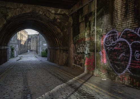 Edinburgh, Scotland-Jan 17, 2024 - View of tunnel under South Bridge on Cowgate street in Edinburgh, The capital of Scotland. Space for text, Selective focus.