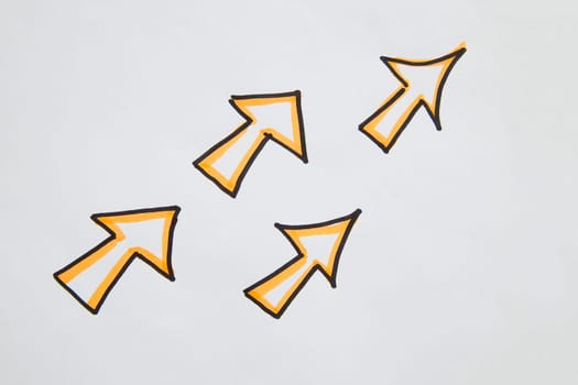 Pack drawn black marker arrows. The concept of business, choosing direction, moving forward. Abstract sign, background, texture. Partial focus, blur