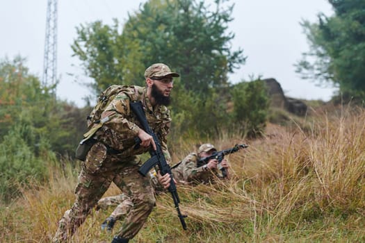 Elite soldiers stealthily maneuver through the dense forest, camouflaged in specialized gear, as they embark on a covert and strategic military mission.