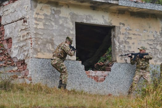 In a high stakes mission, a specialized military unit executes a tactical operation to secure a dangerous house where terrorists are believed to be hiding, showcasing precision and coordinated maneuvers.