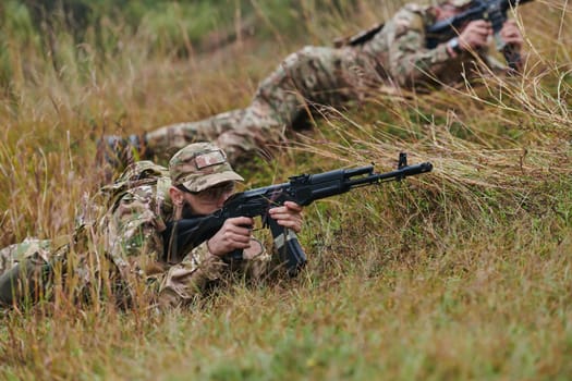 Elite soldiers stealthily maneuver through the dense forest, camouflaged in specialized gear, as they embark on a covert and strategic military mission.