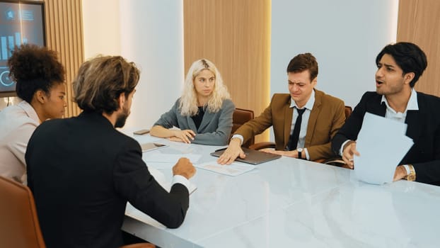 Diverse office worker employee working and brainstorm on strategic business marketing planning. Teamwork and positive attitude create productive and supportive in ornamented business office workplace.