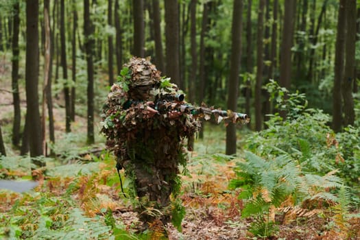 A highly skilled elite sniper, camouflaged in the dense forest, stealthily maneuvers through dangerous woodland terrain on a covert and precise mission.