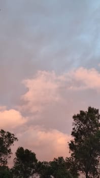 Blue pink light sky nature gray clouds whether background . High quality photo
