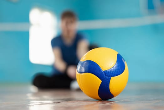 Playing volleyball concept, new ball on the floor on court