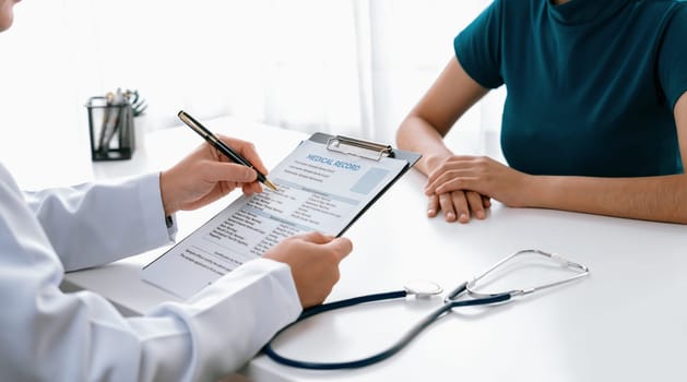 Patient attend doctor's appointment at clinic or hospital office, discussing medical treatment options and explaining examination results or medical record about sickness. Panorama Rigid