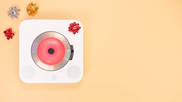 White cd player with red disc on yellow background. Love music, Valentine day, Greeting, retro Love song, space for text