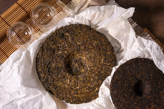 Chinese Puerh tea in the package. the Chinese dry the tea. the view from the top. Shen PUerh, Shu puer.