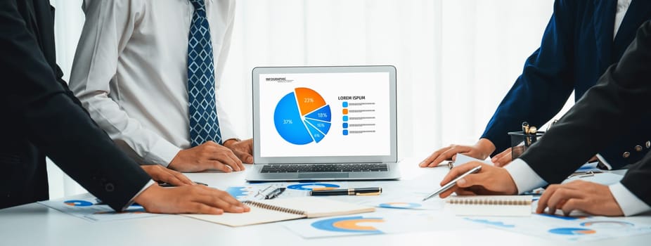 Business people in group meeting in formal attire share idea discussing report for company profit in creative workspace for start up business shot in close up view on group meeting table . Oratory .