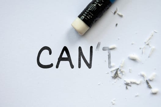 Pencil eraser erasing cannot into can. Motivational and inspirational concept.