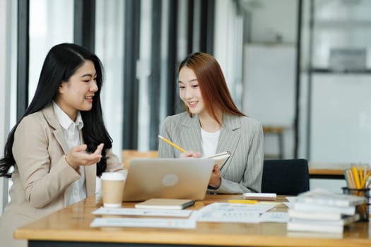 Two business women are discussing the work they have done together and exchanging ideas. To work to develop the business better.