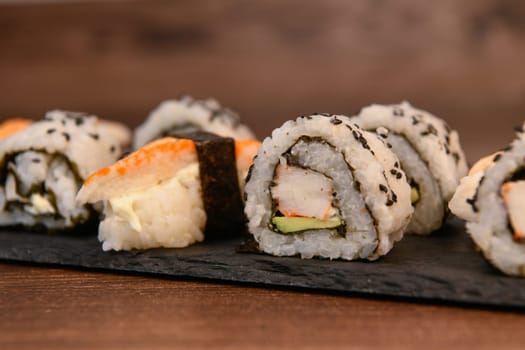 japanese sushi food. Maki ands rolls with tuna, salmon, shrimp, crab and avocado, High quality photo