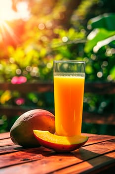 Mango juice in the garden. Selective focus. Drink.