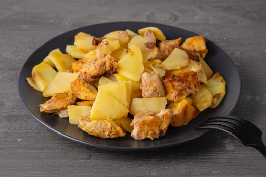 Delicious homemade diced chicken with potato chunks.