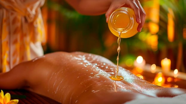 Cosmetic oil in a spa salon on a woman's back. Selective focus. People.