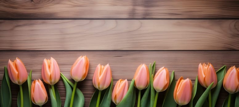 A bouquet of pink tulips arranged elegantly on a polished wooden surface, emphasizing contrast and natural beauty.