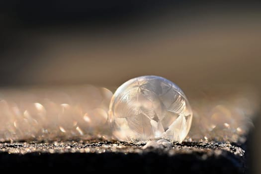 Beautiful ice bubble. Macro shot of winter nature. Frost - ice and frozen water at a low temperature.