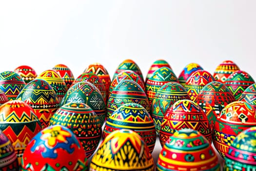 Many colourful Easter eggs stand close by. An aerial view of the dyed eggs in patterns. Close-up of the tops of the coloured eggs.