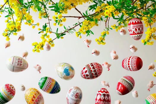 At the top are branches from a forsythia bush with yellow flowers. A rain of colourful Easter eggs falls from above. In between the Easter eggs also fall little chicks.