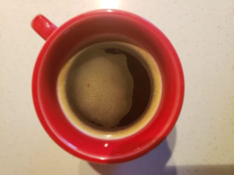 View of Coffee in a Red Mug Looking From Above