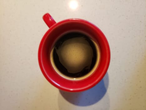 View of Coffee in a Red Mug Looking From Above