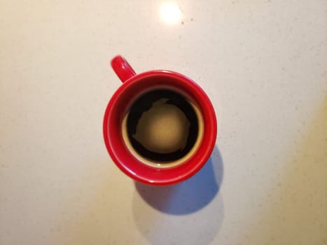 View of Coffee in a Red Mug Looking From Above