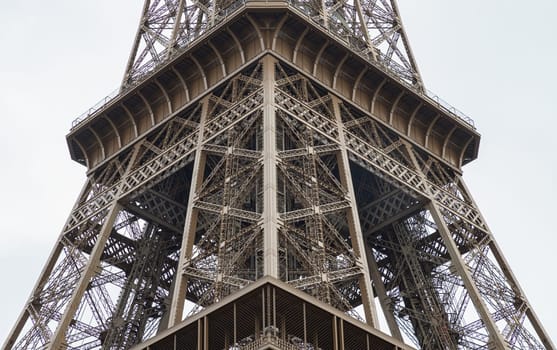 France, Paris - Jan 4, 2024 - Architectural detail design of the famous Eiffel Tower iron structure. Close-up of the framework of the Eiffel Tower in Paris, France, Space for text, Selective focus.