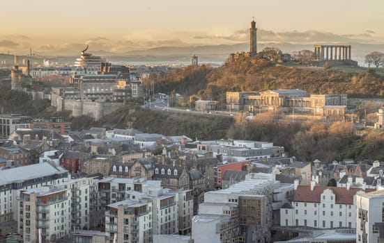 Edinburgh, Scotland - Jan 17, 2024 - Amazing Edinburgh cityscape view and Calton Hill with the skyline seen from the top of Salisbury Crags. Destinations in Europe, Space for text, Selective focus.