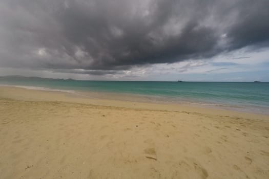 Caribbean beach with white sand, deep blue sky and turquoise water